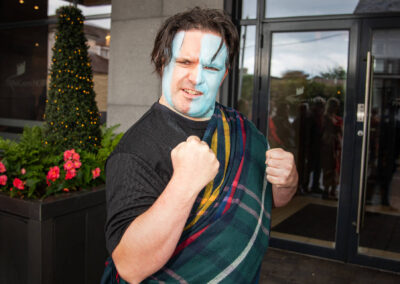 Braveheart fan with face painted blue