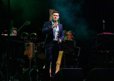 Emmet Cahill singing on stage Voyage Ireland through song