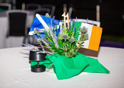 Floral centre pieces on tables with Irish and Scottish flags Braveheart