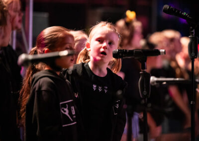 Kids singing King John Summer Prom