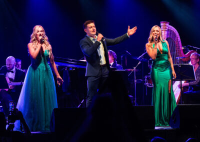 Lead vocalists singing at Voyage Ireland through song