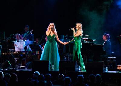 Leading Irish vocalists Shona O Sullivan and Leah Barniville hold hands singing