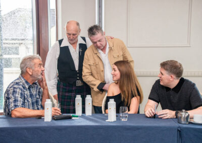 Mel Gibson talking to guests in Trim