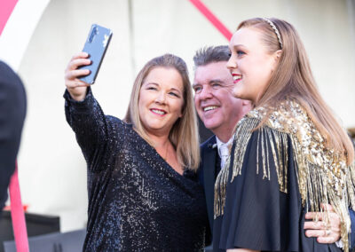 Peter Byrne taking selfies with fans